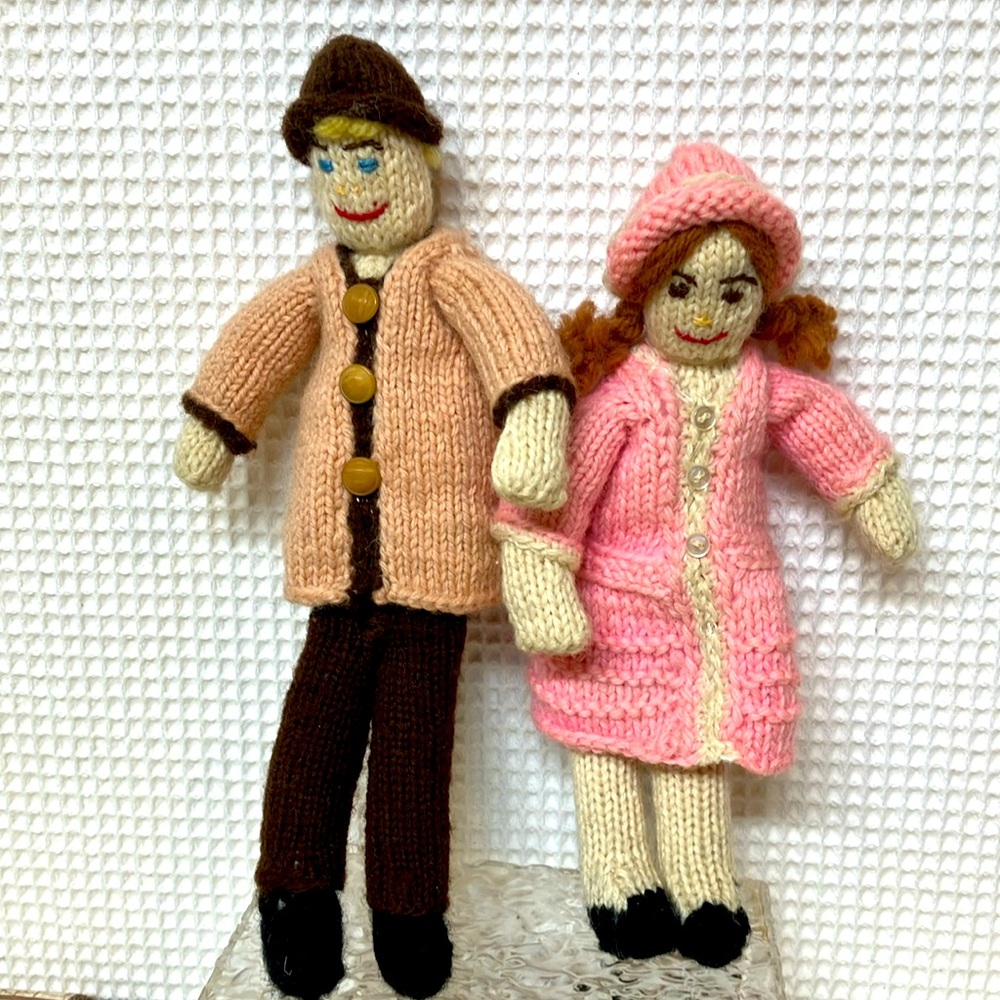 Crocheted boy and girl dolls